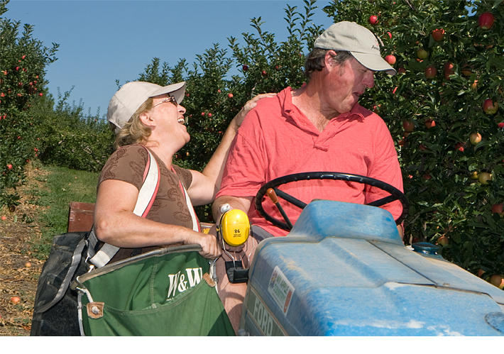 Richard and Denise MacDonald sharing a laugh in their orchard